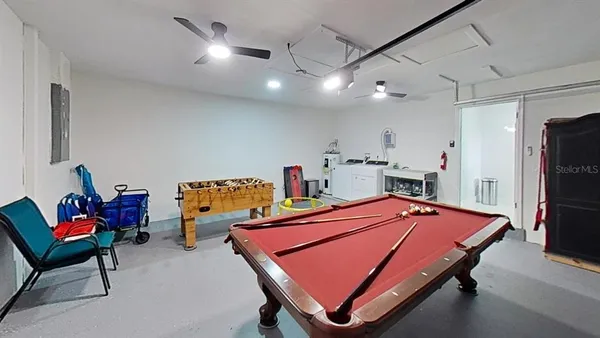 a room with furniture and pool table