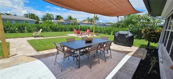 a view of a patio with a table chairs and a patio