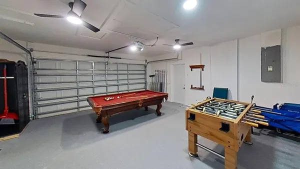 a bedroom with furniture and a chandelier