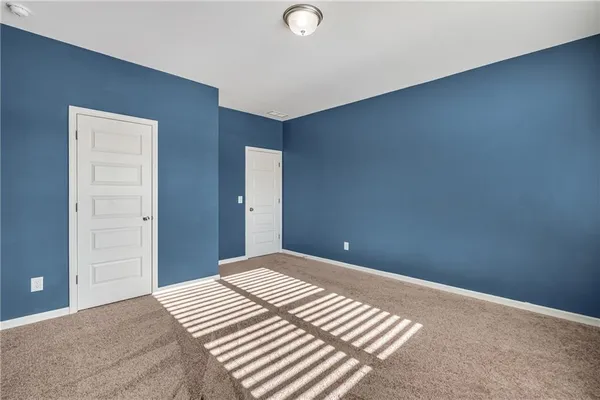 a view of a street with a building in the background