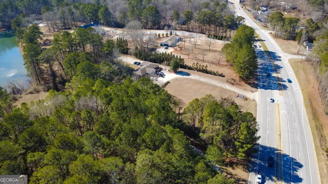 an aerial view of a house with a yard