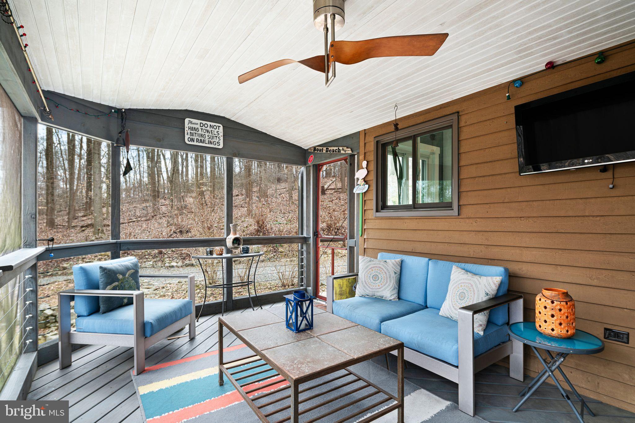 41 Lyons Run Road Glenmoore, PA 19343 - Photo 45 of 52 Serene screened porch with wooded views.