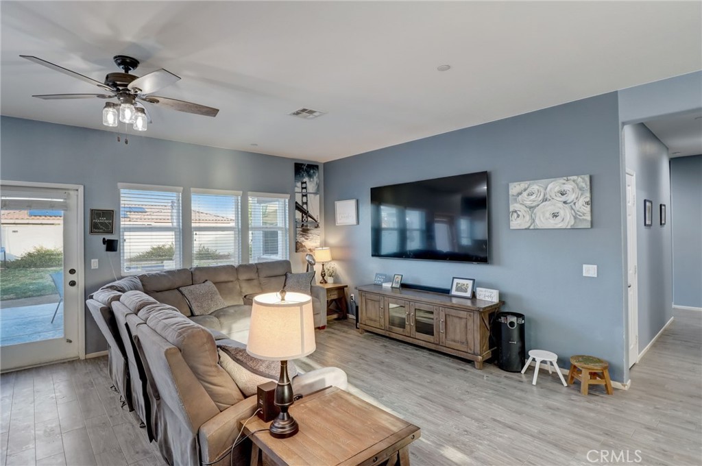 1667 Constant Trail San Jacinto, CA 92582 - Photo 14 of 44 a living room with furniture and a flat screen tv