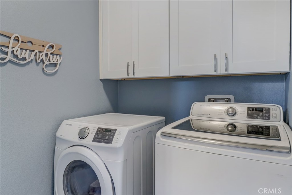 1667 Constant Trail San Jacinto, CA 92582 - Photo 17 of 44 a utility room with dryer and washer
