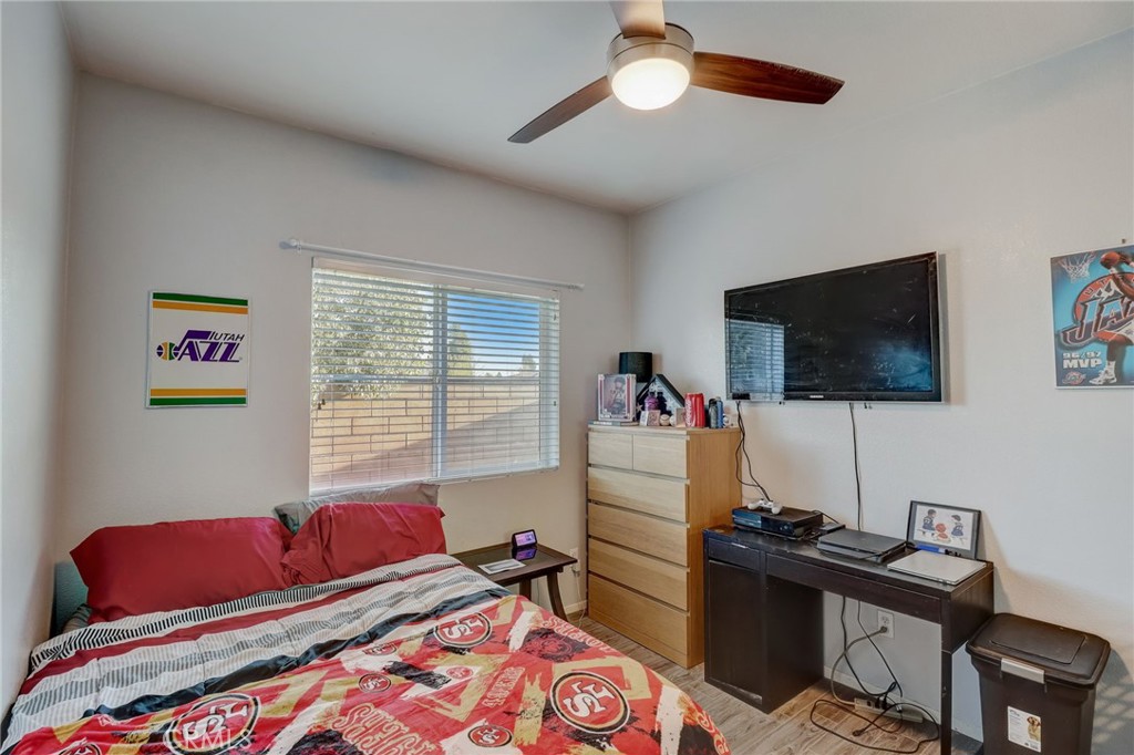 1667 Constant Trail San Jacinto, CA 92582 - Photo 19 of 44 a living room with furniture and a flat screen tv