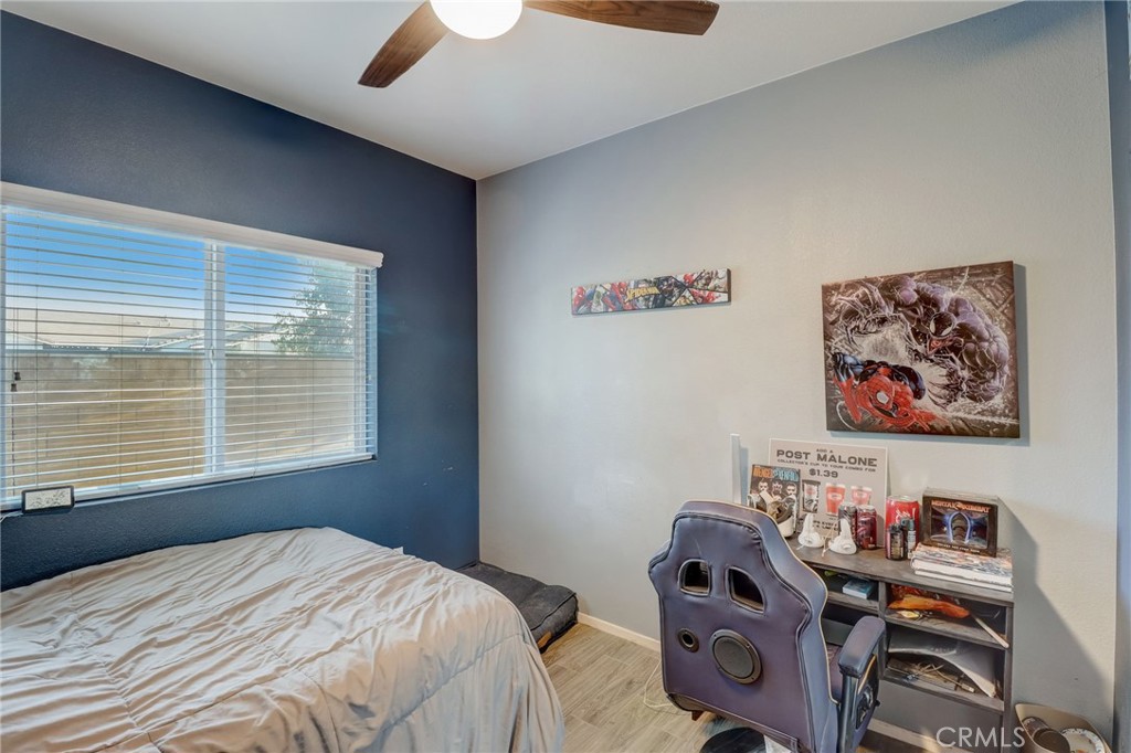 1667 Constant Trail San Jacinto, CA 92582 - Photo 21 of 44 a bedroom with furniture and a window