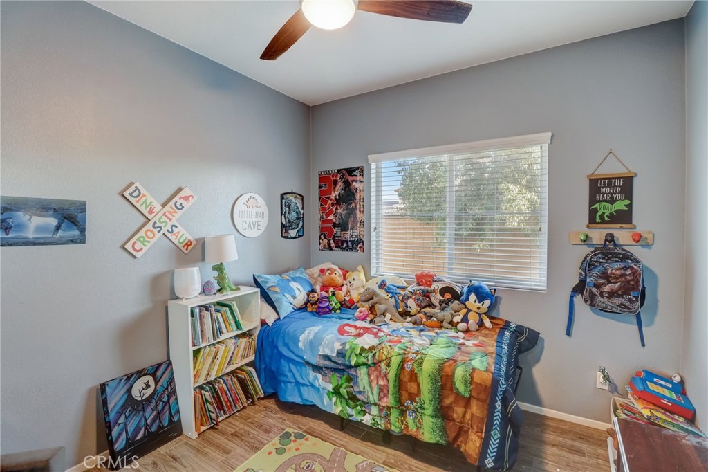 1667 Constant Trail San Jacinto, CA 92582 - Photo 24 of 44 a bedroom with furniture and a window