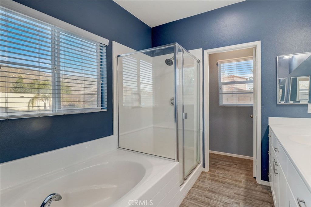 1667 Constant Trail San Jacinto, CA 92582 - Photo 28 of 44 a bathroom with a bathtub and a shower