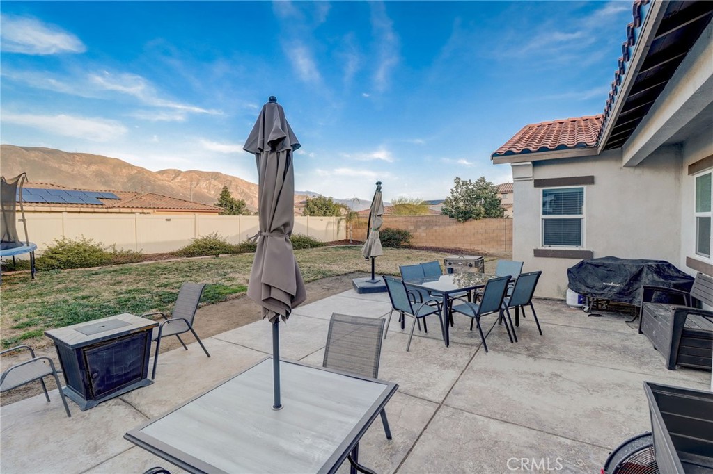 1667 Constant Trail San Jacinto, CA 92582 - Photo 29 of 44 a view of a patio with a table chairs and outdoor space