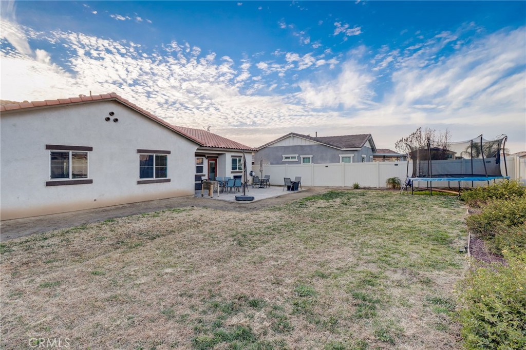 1667 Constant Trail San Jacinto, CA 92582 - Photo 32 of 44 a view of a house with a backyard