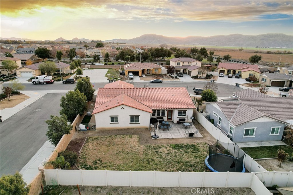 1667 Constant Trail San Jacinto, CA 92582 - Photo 40 of 44 a aerial view of a house with a garden and lake view