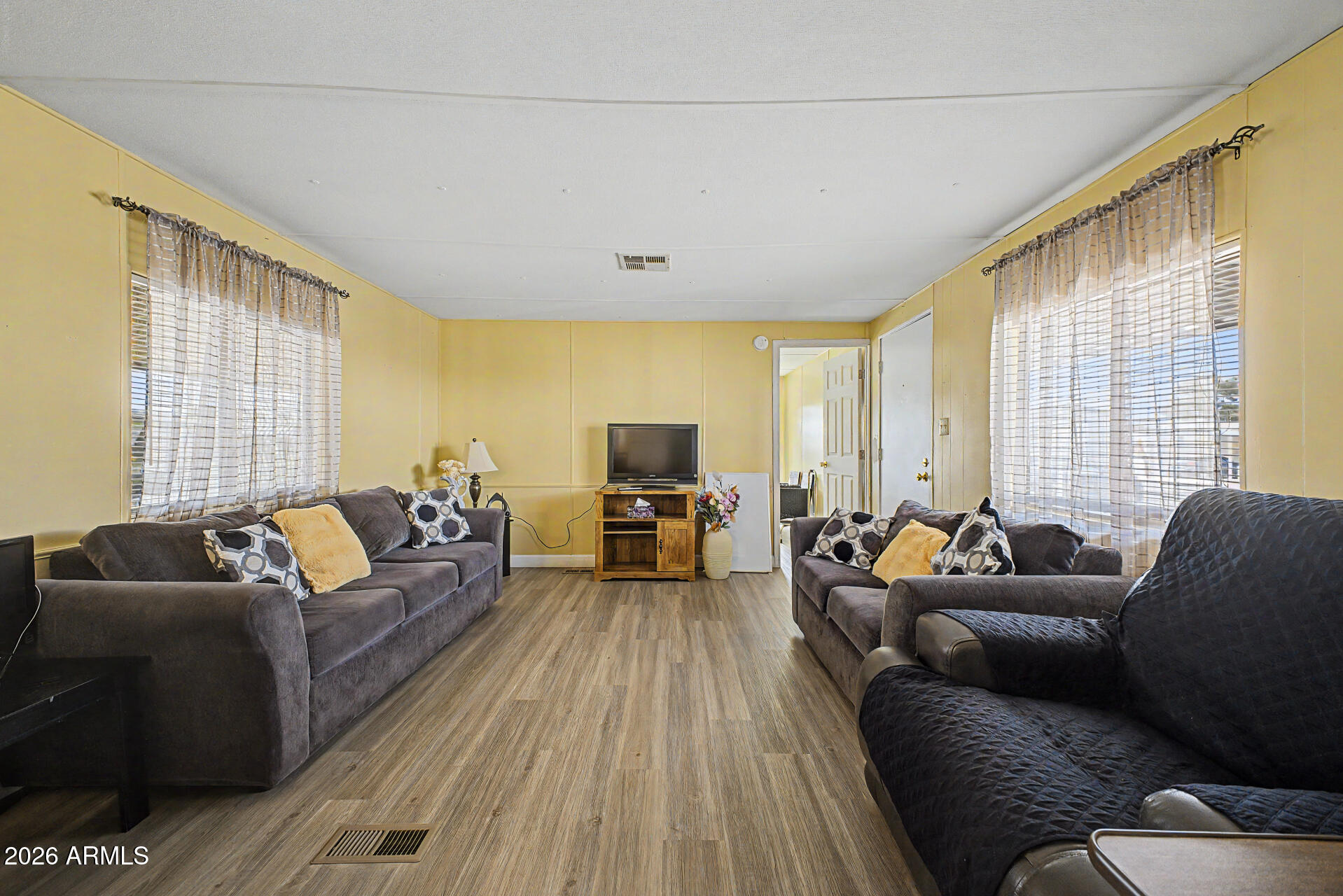 535 South Alma School Road, Unit 40 Mesa, AZ 85210 - Photo 11 of 33 a living room with furniture and a flat screen tv