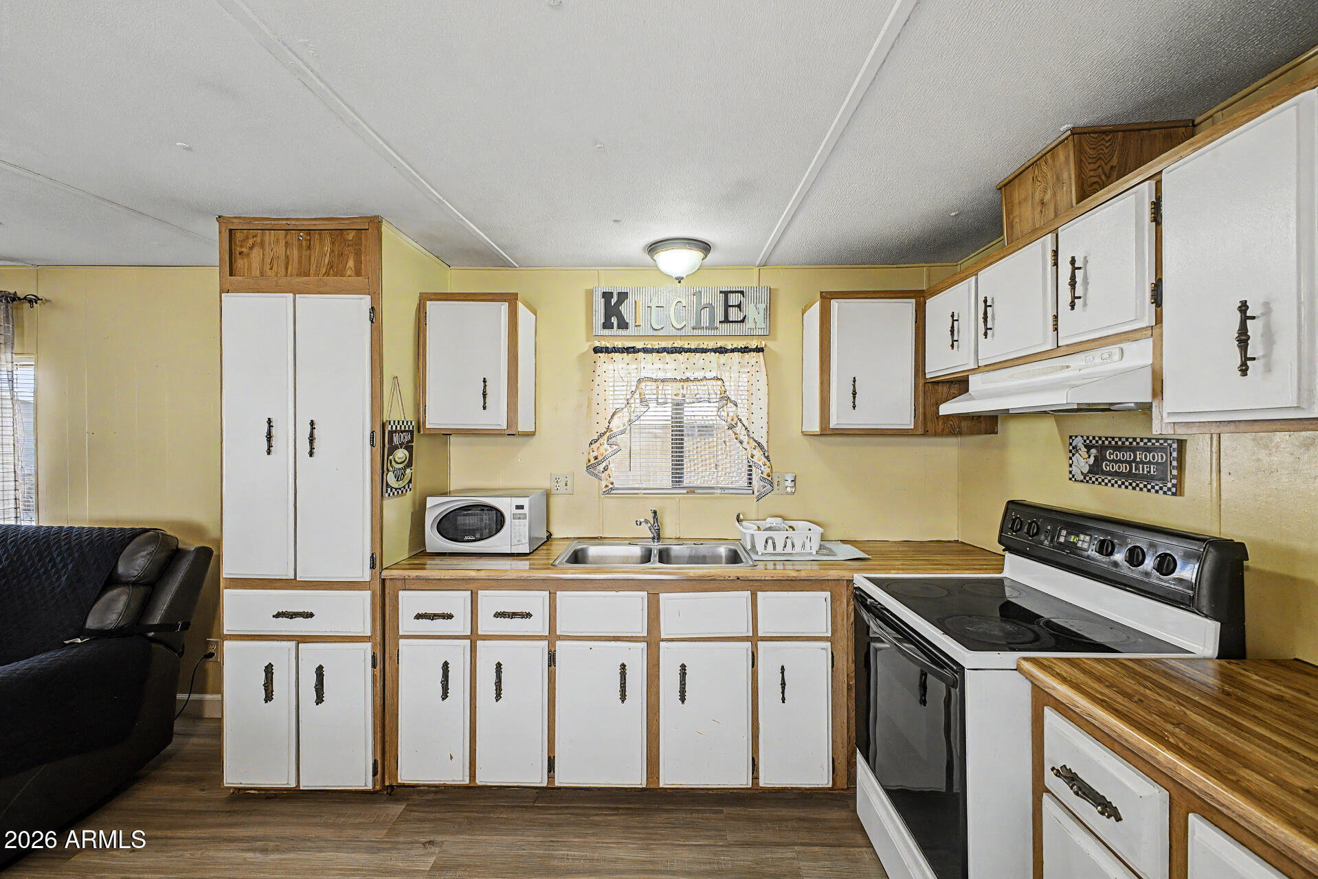 535 South Alma School Road, Unit 40 Mesa, AZ 85210 - Photo 17 of 33 a kitchen with stainless steel appliances granite countertop a sink and cabinets
