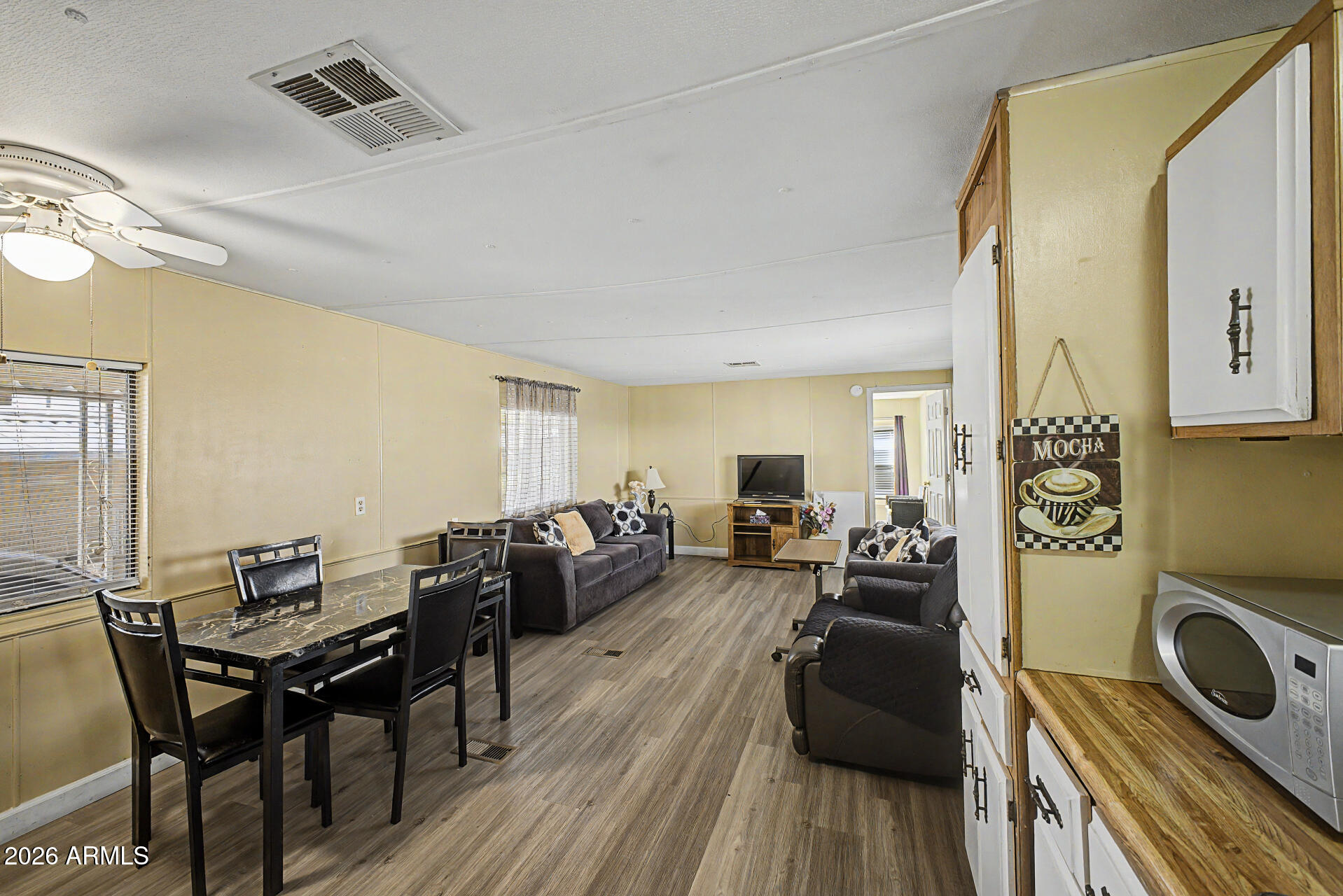 535 South Alma School Road, Unit 40 Mesa, AZ 85210 - Photo 18 of 33 a living room with furniture and wooden floor