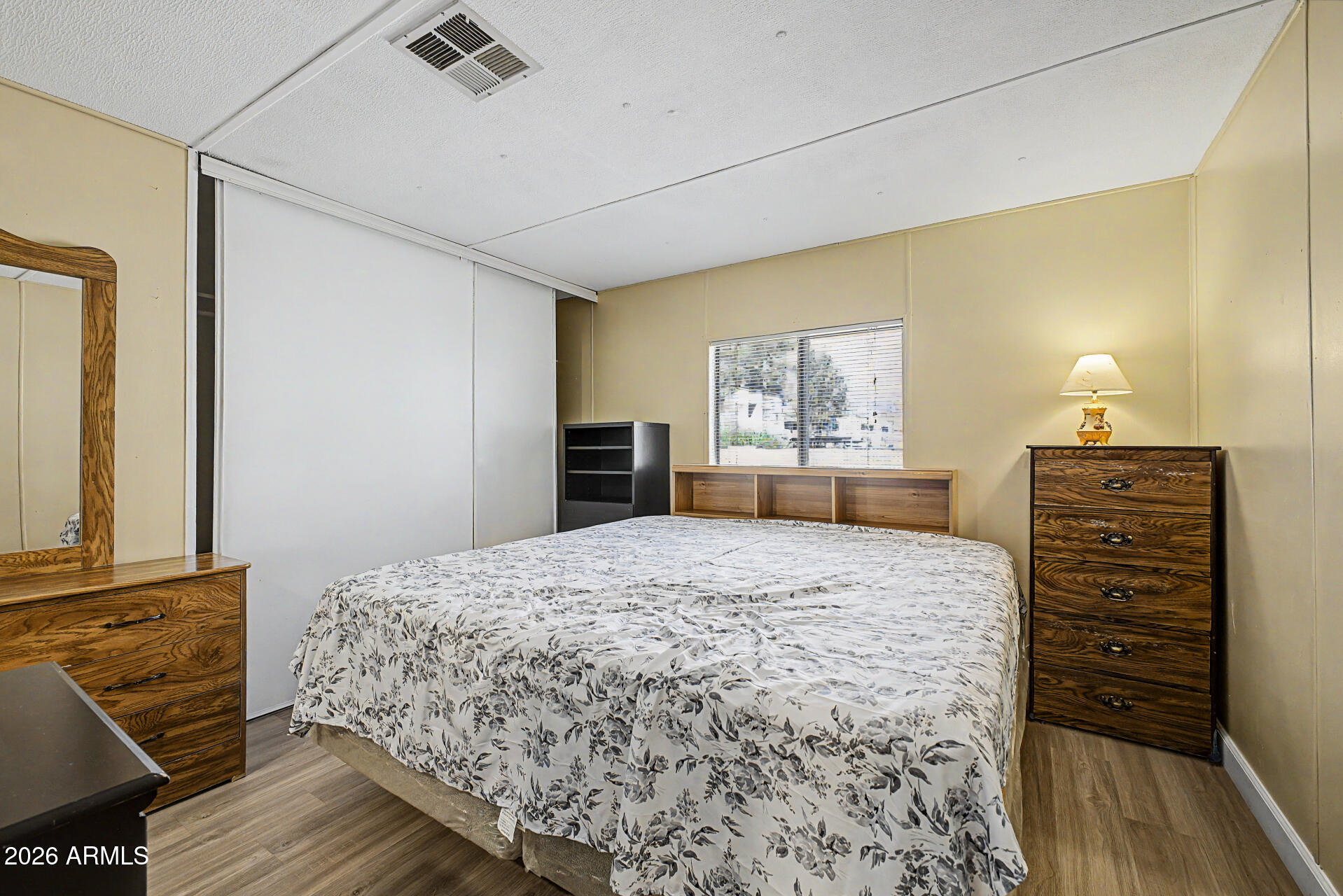535 South Alma School Road, Unit 40 Mesa, AZ 85210 - Photo 19 of 33 a bedroom with a bed and a dresser