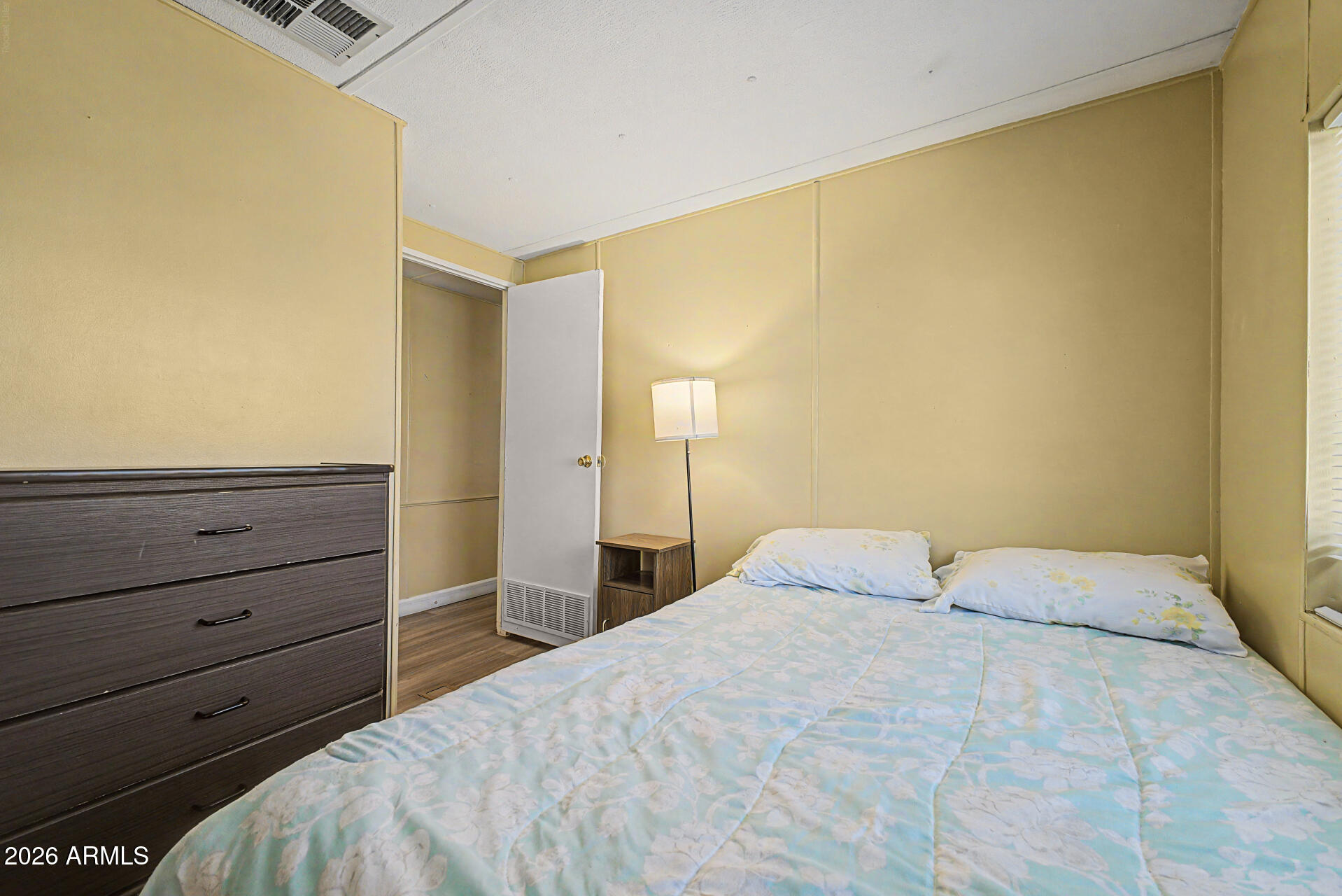 535 South Alma School Road, Unit 40 Mesa, AZ 85210 - Photo 24 of 33 a bedroom with a bed and a window