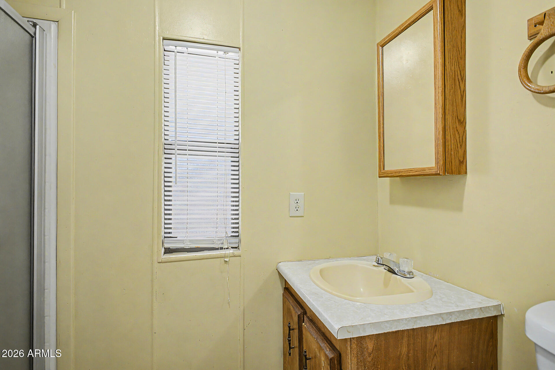 535 South Alma School Road, Unit 40 Mesa, AZ 85210 - Photo 27 of 33 a bathroom with a sink and a mirror