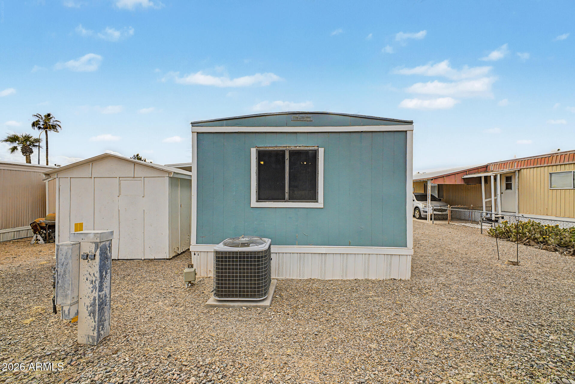 535 South Alma School Road, Unit 40 Mesa, AZ 85210 - Photo 30 of 33 a backyard of a house with barbeque oven stove and table