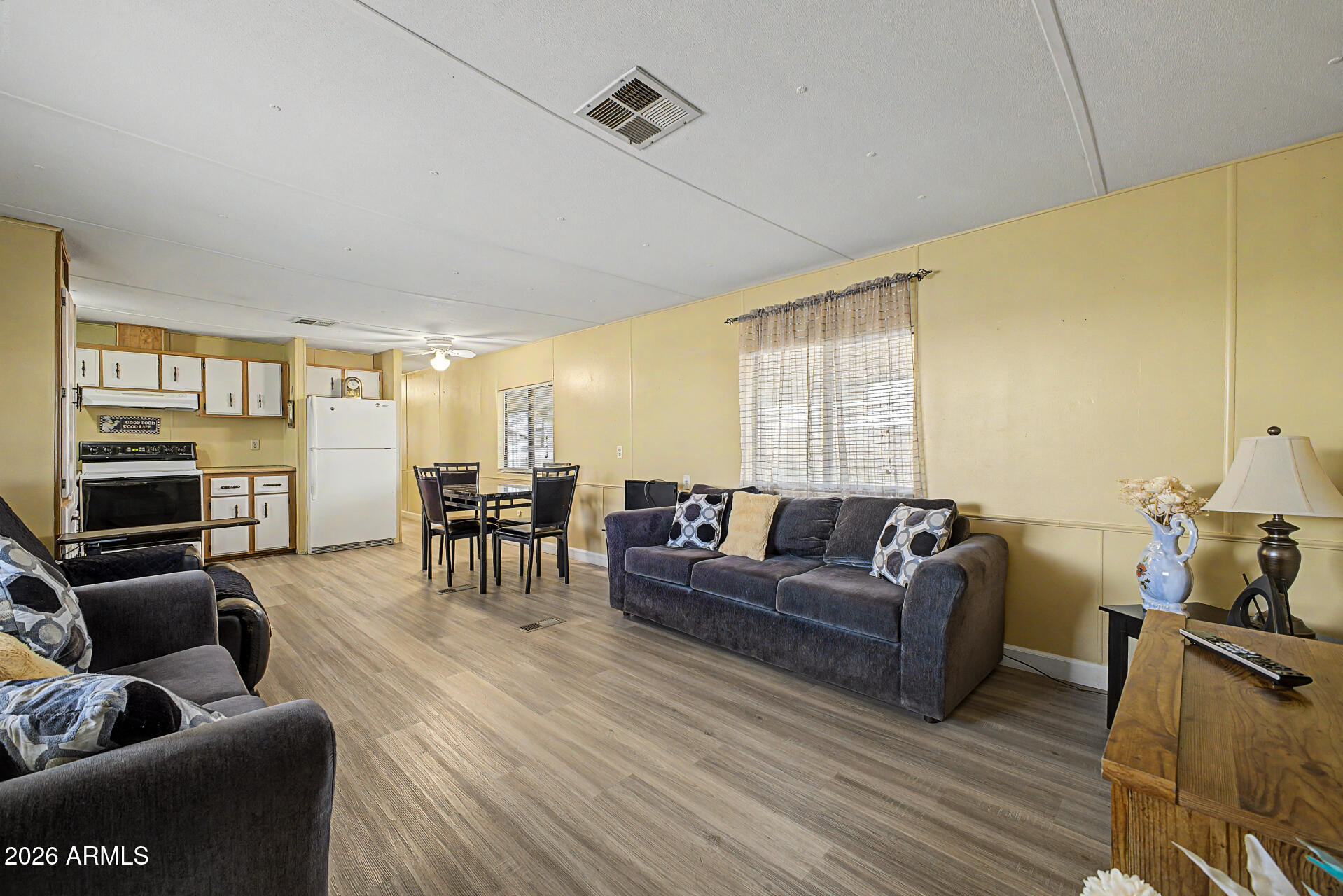 535 South Alma School Road, Unit 40 Mesa, AZ 85210 - Photo 9 of 33 a living room with furniture and a flat screen tv