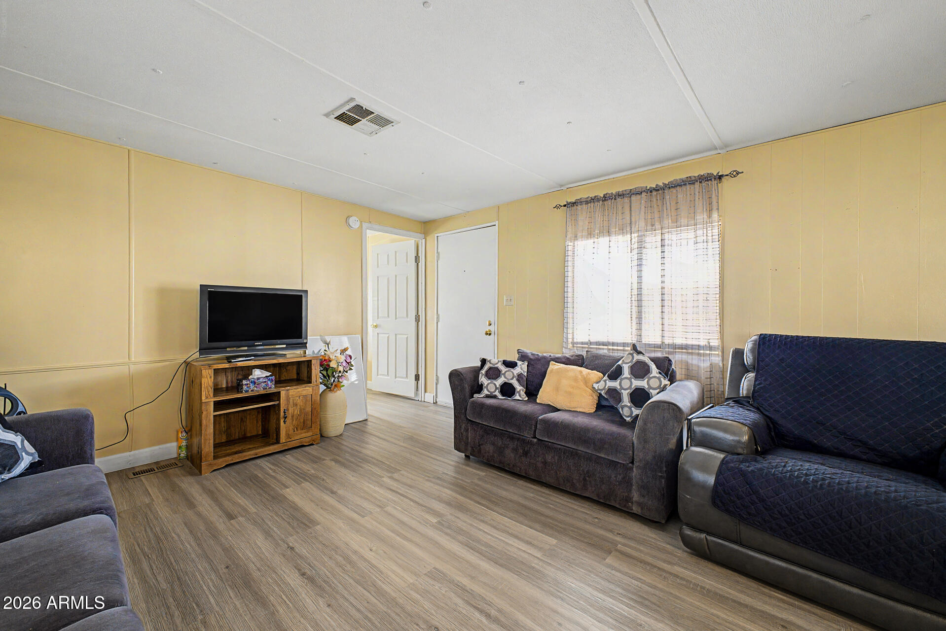 535 South Alma School Road, Unit 40 Mesa, AZ 85210 - Photo 10 of 33 a living room with furniture and a flat screen tv