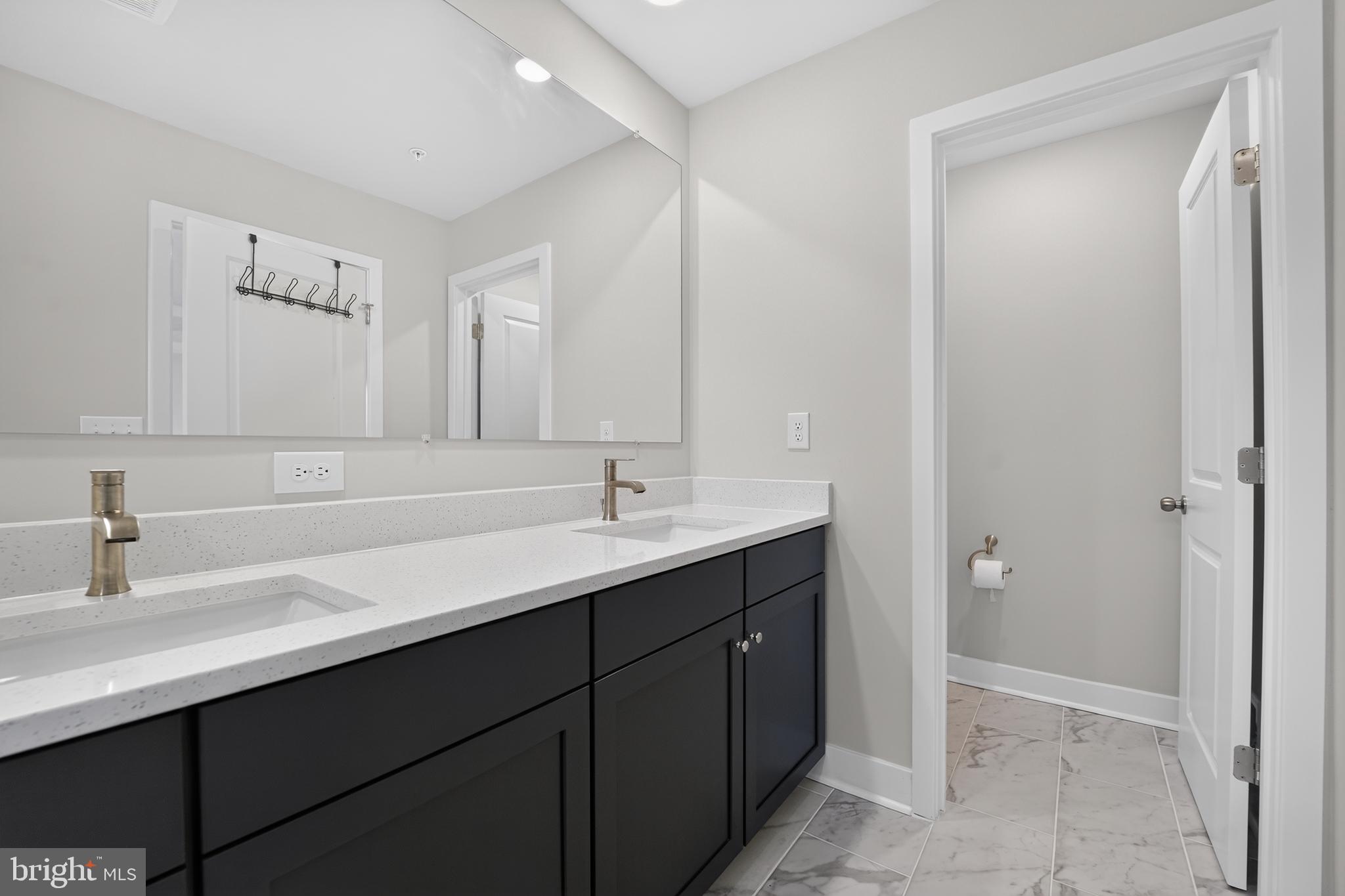 1808 Parham Way Baltimore, MD 21244 - Photo 19 of 31 Sleek modern bathroom with elegance.