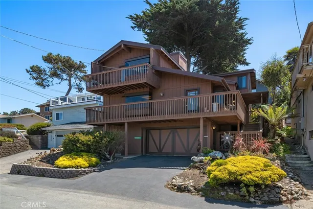 an aerial view of a house with yard swimming pool and outdoor seating