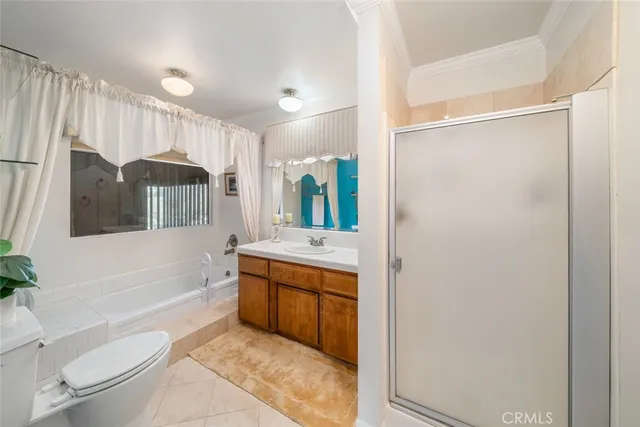 a bedroom with a bed and a dresser in it