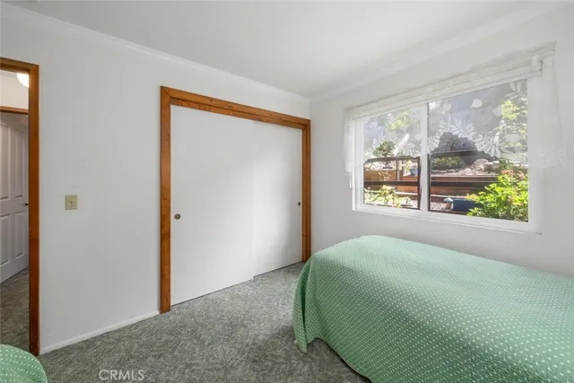 a kitchen with stainless steel appliances granite countertop a table chairs and a refrigerator