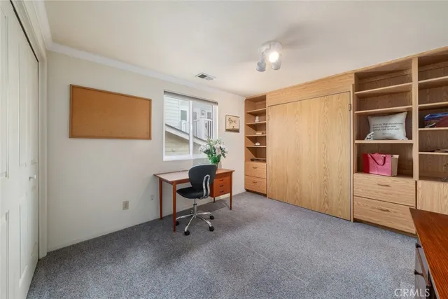 a bedroom with a bed and a tv in it