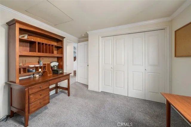 a view of a room with cabinet and mirrors
