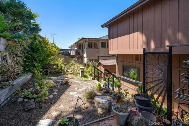 an aerial view of residential houses with yard