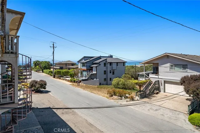 a kitchen with stainless steel appliances granite countertop a sink and a refrigerator