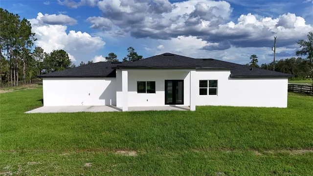 a view of backyard with green space