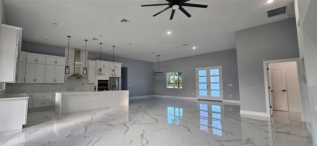 a view of a kitchen with a sink and dishwasher