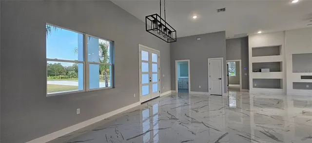 a view of an entryway with a chandelier