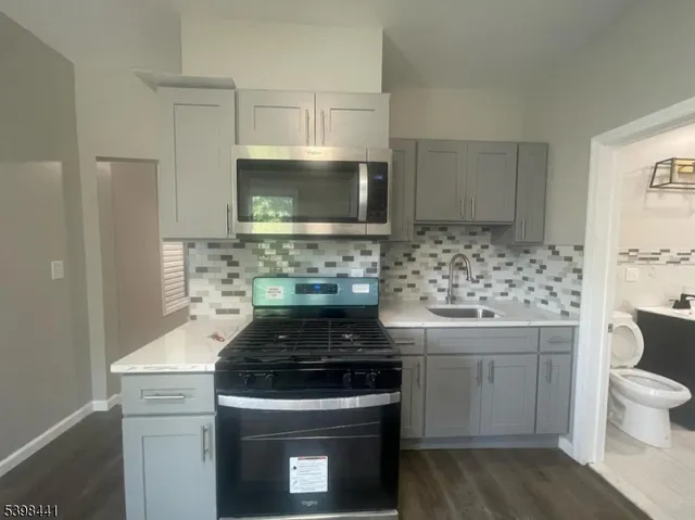 a kitchen with a stove and a sink