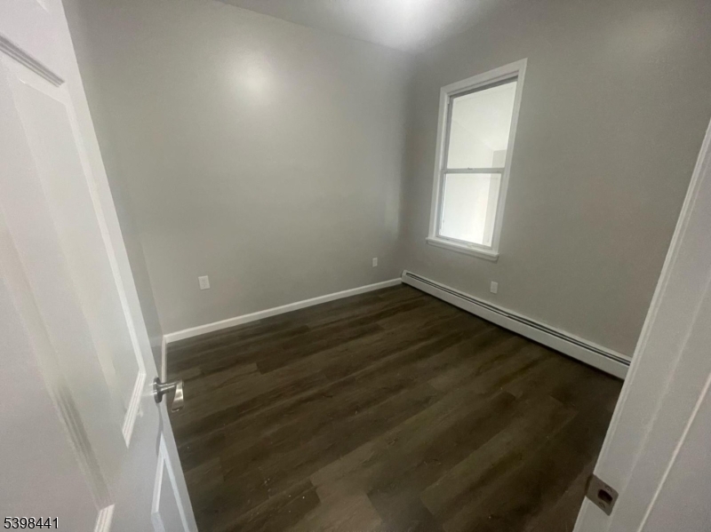 160 12th Avenue, Unit 2 Paterson, NJ 07501 - Photo 15 of 17 wooden floor in an empty room