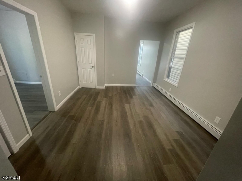 160 12th Avenue, Unit 2 Paterson, NJ 07501 - Photo 2 of 17 wooden floor in an empty room