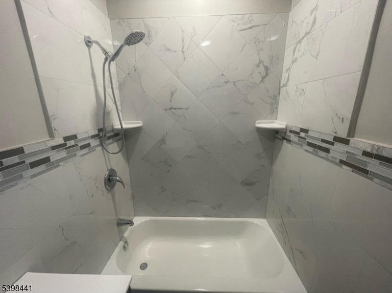 160 12th Avenue, Unit 2 Paterson, NJ 07501 - Photo 4 of 17 a bathroom with a shower