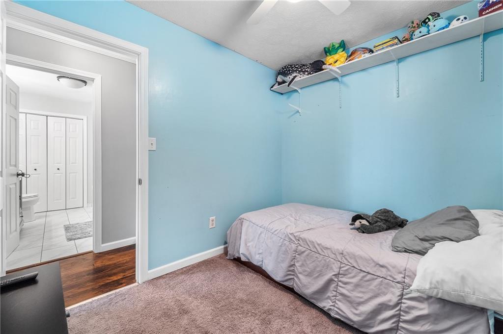 604 Lincoln Street Rochester, PA 15074 - Photo 13 of 23 a bedroom with a bed and a window