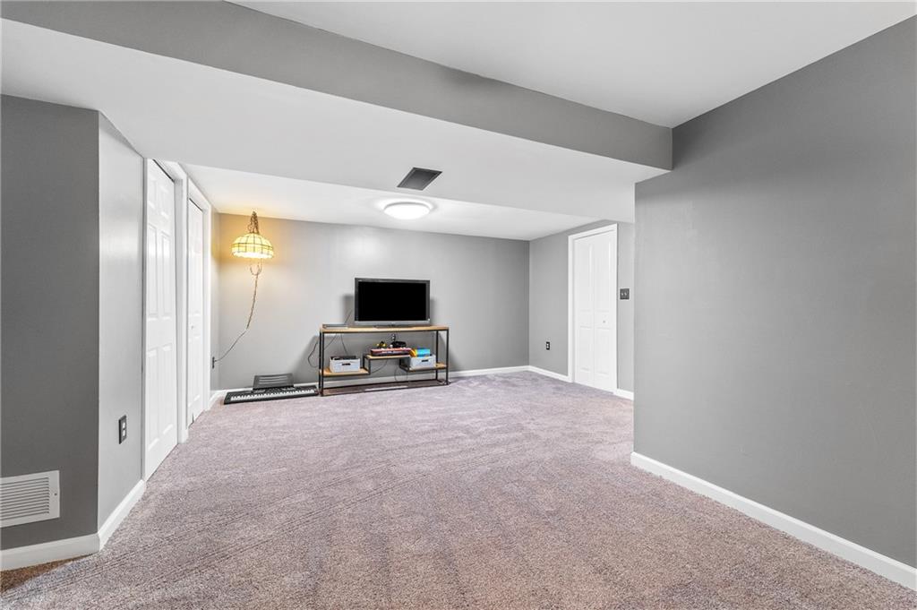 604 Lincoln Street Rochester, PA 15074 - Photo 17 of 23 a view of a livingroom with a flat screen tv