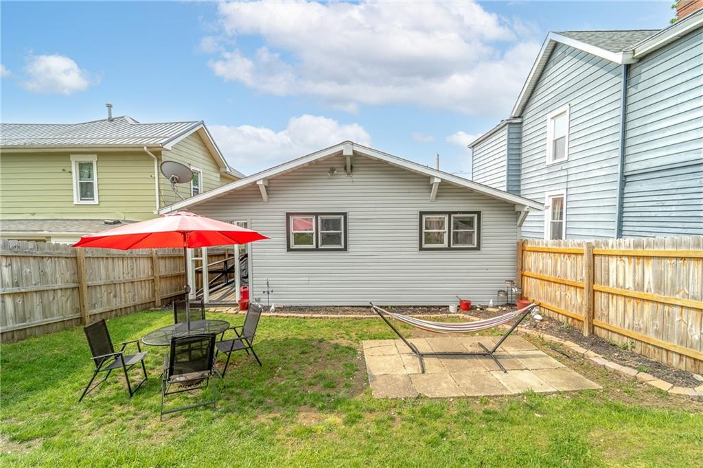 604 Lincoln Street Rochester, PA 15074 - Photo 21 of 23 a patio with a table and chairs