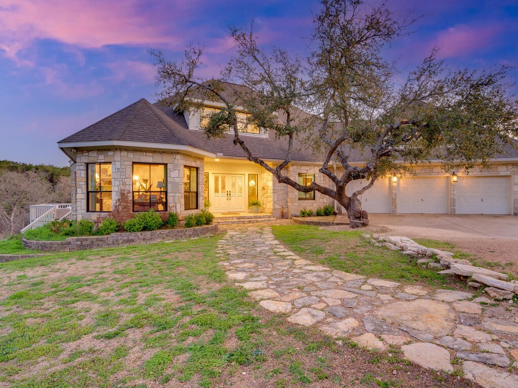 a front view of a house with garden