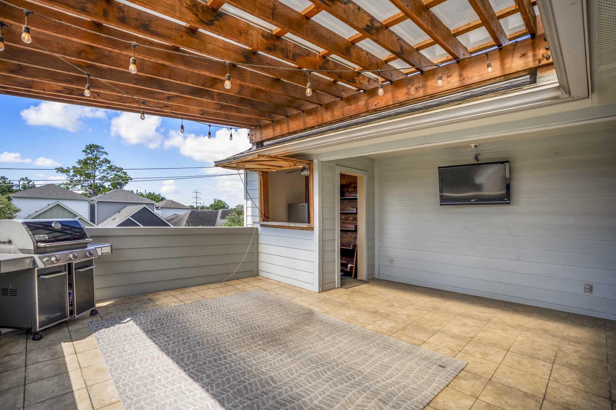 4236 Drake Street Houston, TX 77005 - Photo 36 of 43 Just outside the gameroom on the third floor is a generously sized rooftop terrace with a custom pergola cover and a bar build-out.