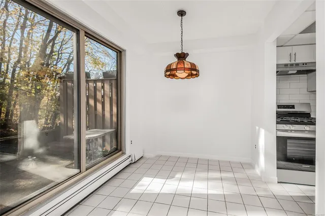 a view of an empty room and a window