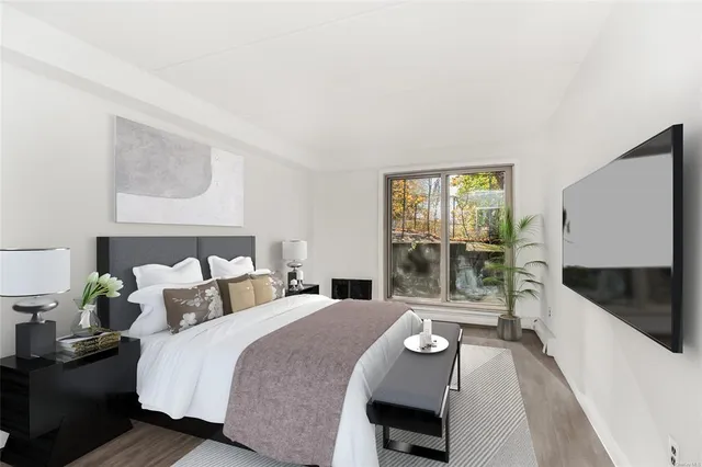 a bedroom with a bed and glass window