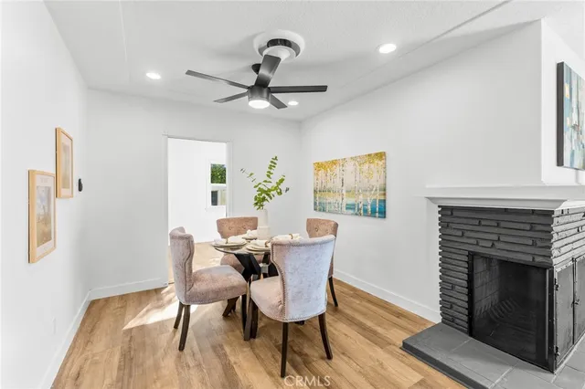 a kitchen with stainless steel appliances a stove a sink a refrigerator a microwave and cabinets