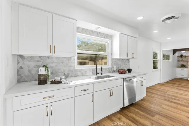a view of a livingroom with a ceiling fan and window