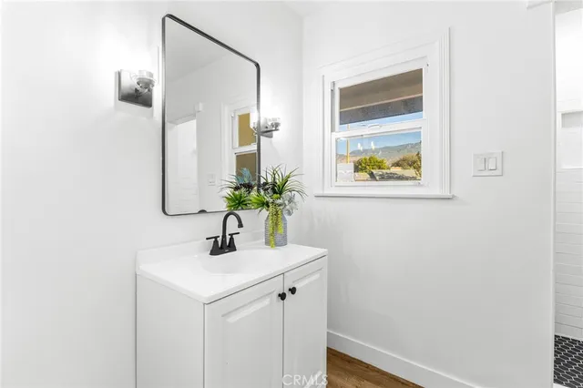 a bathroom with a sink and a mirror