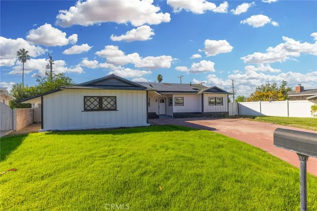 a view of a hallway with wooden floor and closet